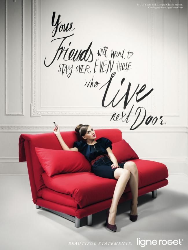Poster: Elegant woman lounging on a red sofa bed