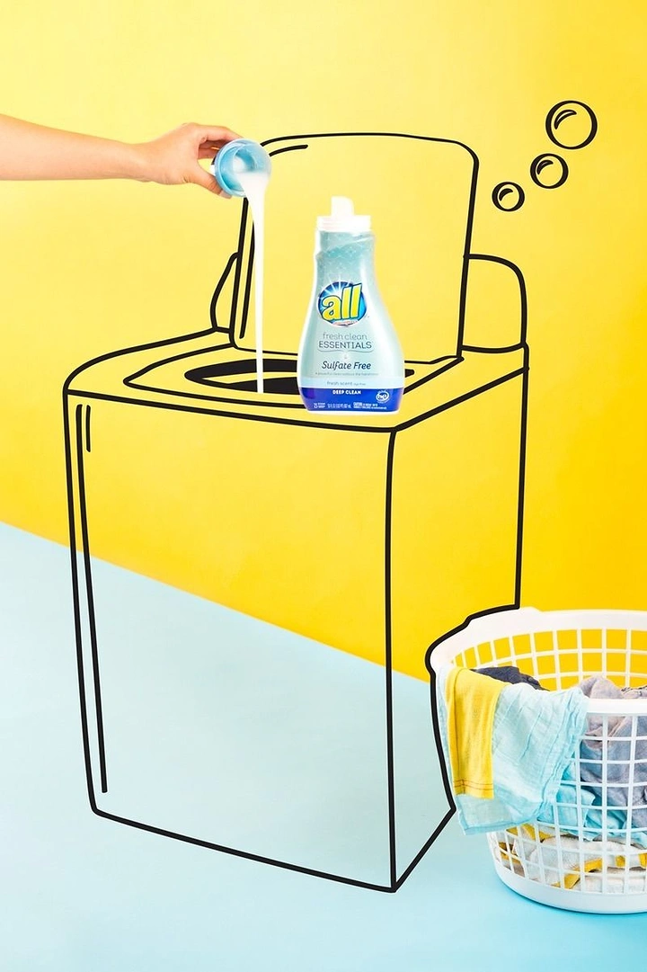 Laundry & Dry Cleaning creative ad: Line-drawn washer with real detergent pour