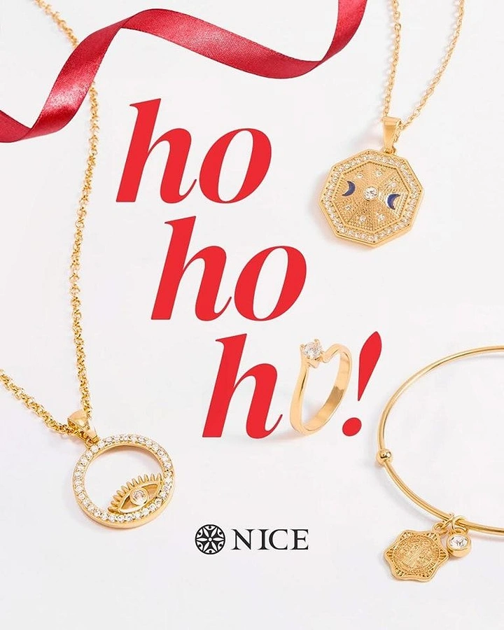 Christmas creative ad: Gold pendant necklaces, a ring and a bangle around giant red text