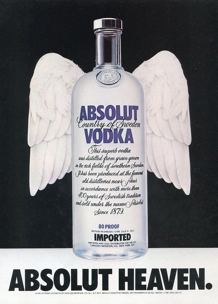 Creative ad: Clear vodka bottle with white feathered angel wings