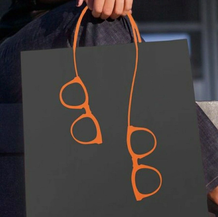Opticians & Eye Care creative ad: Bag handles shaped into eyeglasses