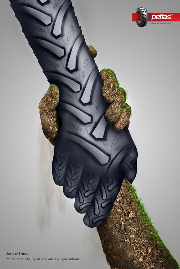 Poster: Tractor-tyre hand clasping a soil-and-grass hand