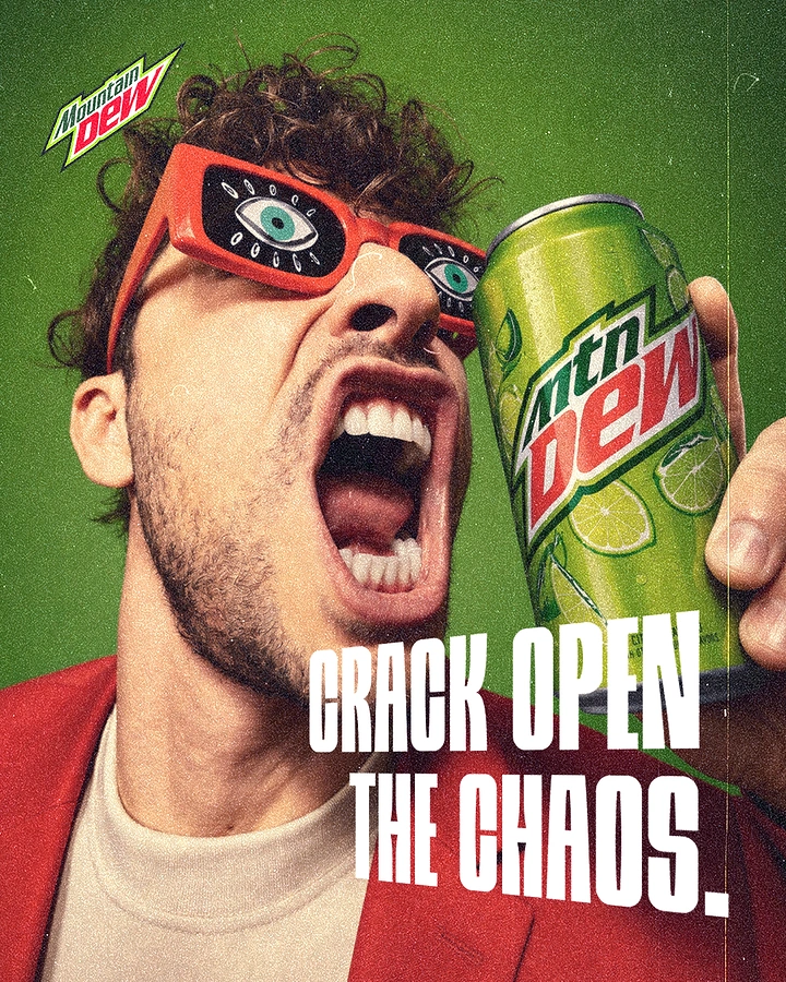 Creative ad: Screaming curly-haired man in eye-print sunglasses holding a lime soda can