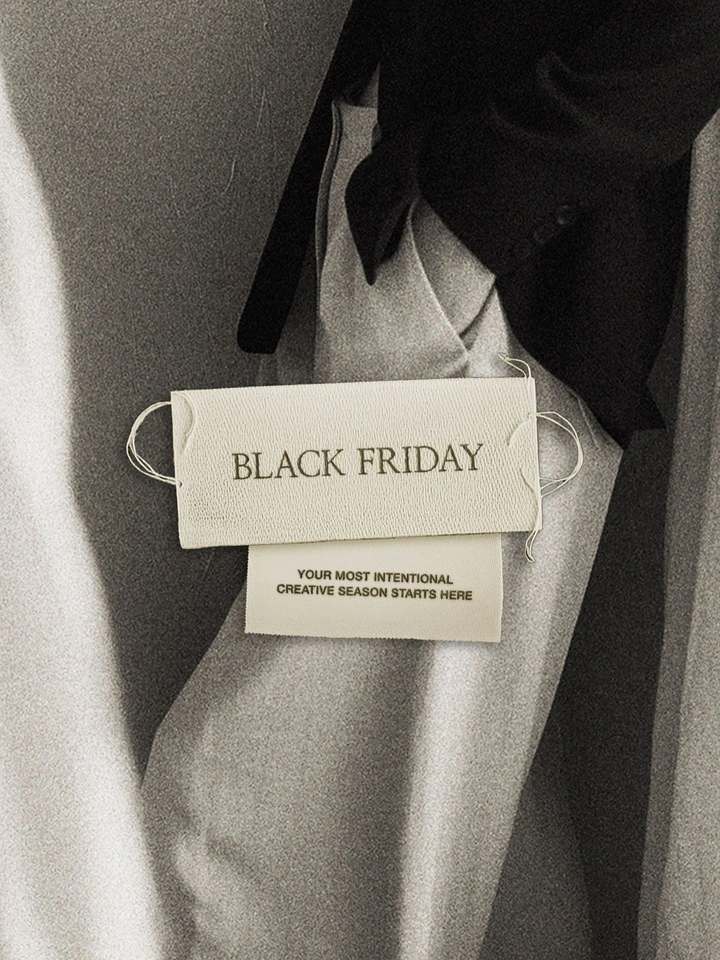 Black Friday creative ad: Woven clothing label on draped fabric