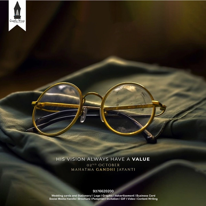 Gandhi Jayanti creative ad: Gold round-rim spectacles resting on folded olive cloth