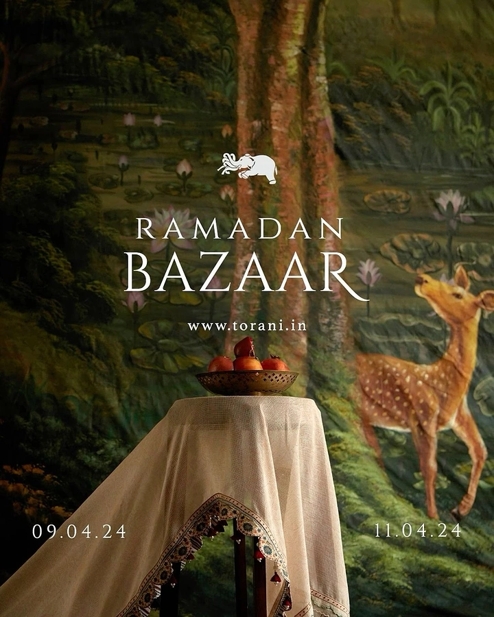 Ramadan creative ad: Draped plinth with a brass bowl of pomegranates before a painted forest mural