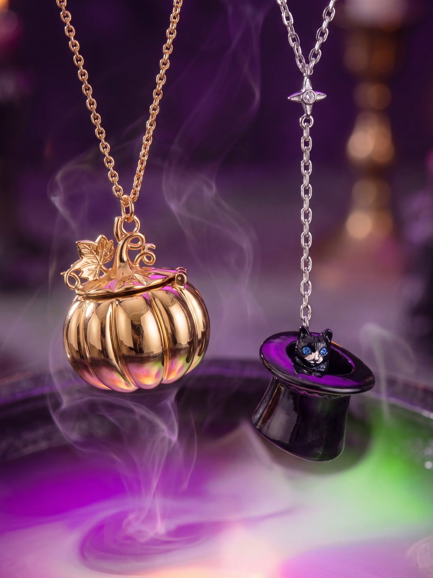 Green witch hand holding a vampire-fang pendant necklace