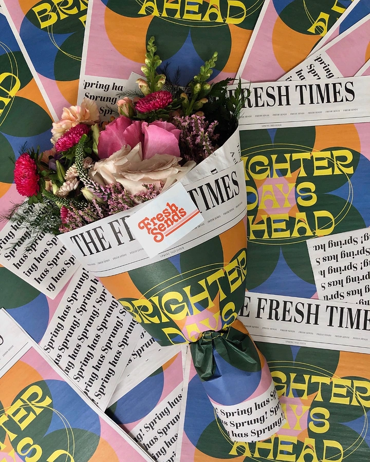 Florists creative ad: A colorful flower bouquet wrapped in editorial-style printed paper