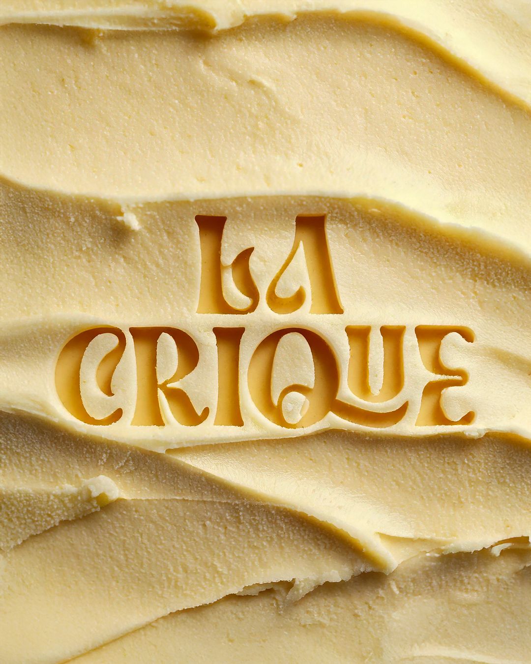 Instagram post: Brand name debossed into a smooth swirled surface of pale gelato