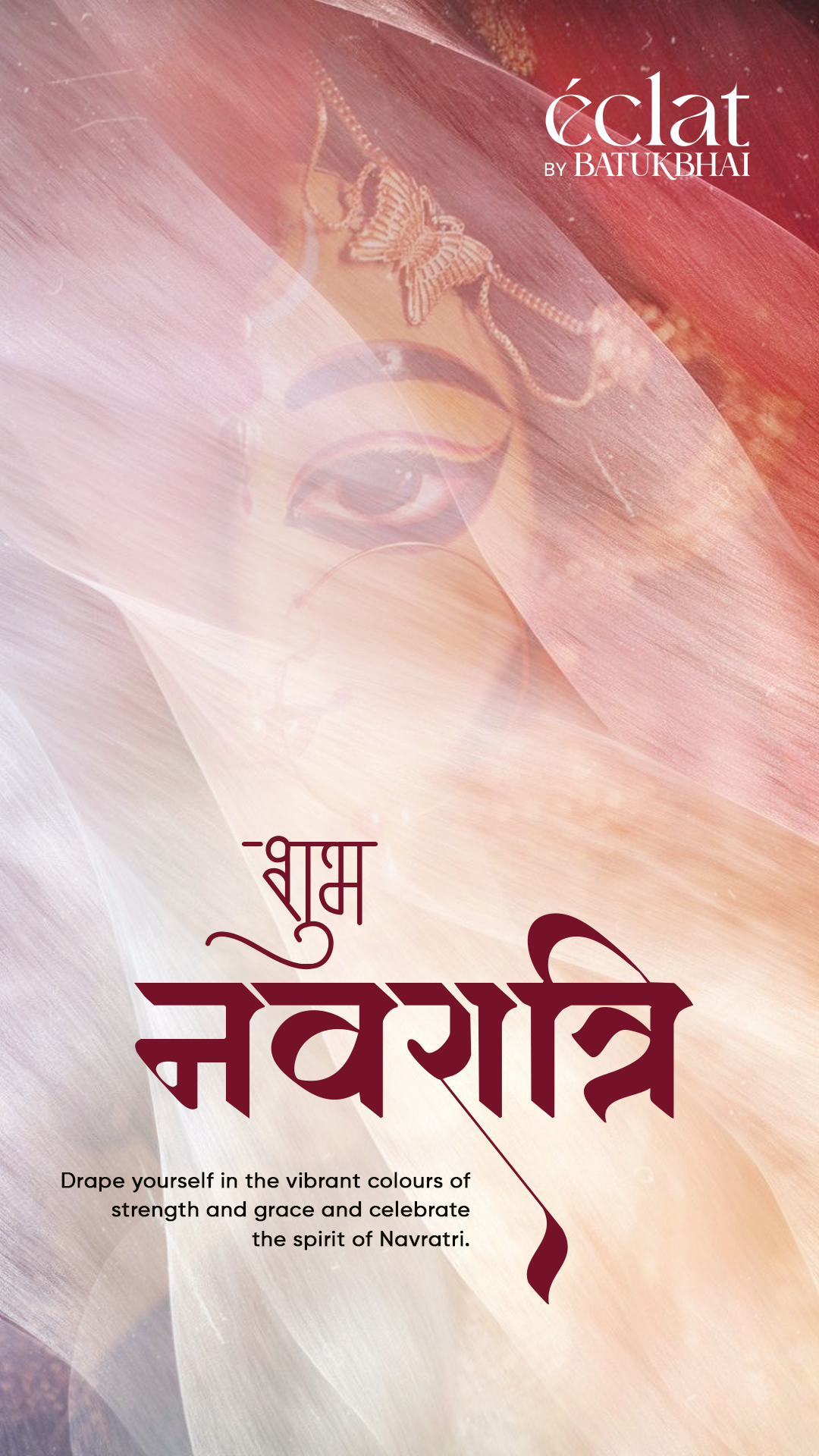 Close-up of a Durga idol's eye veiled behind sheer flowing fabric