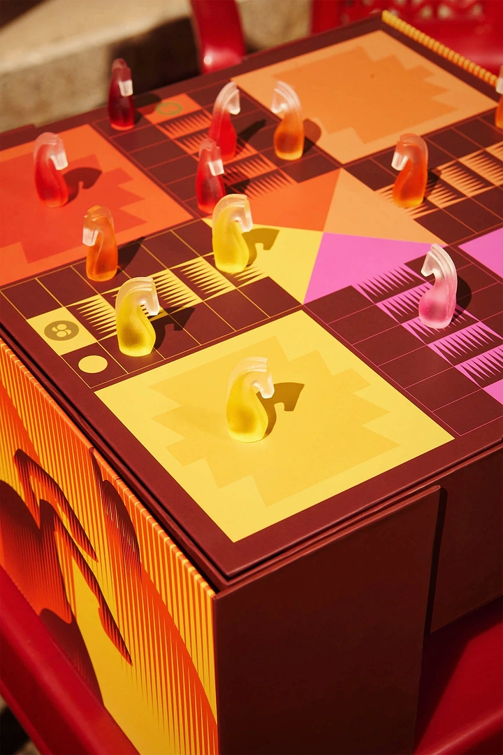 Board Games & Game Cafes creative ad: Immersive board-game world as neon installation