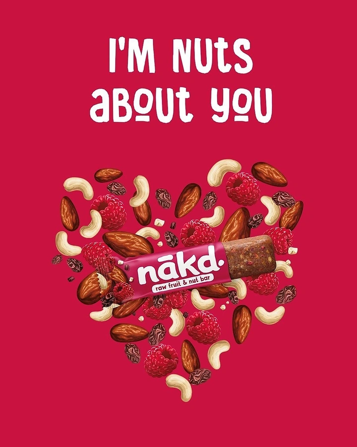 Valentine's Day creative ad: Snack bar inside a heart made of nuts and raspberries
