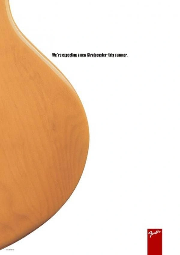 Musical Instrument Stores creative ad: Close crop of a natural-wood guitar body curve resembling a pregnant belly