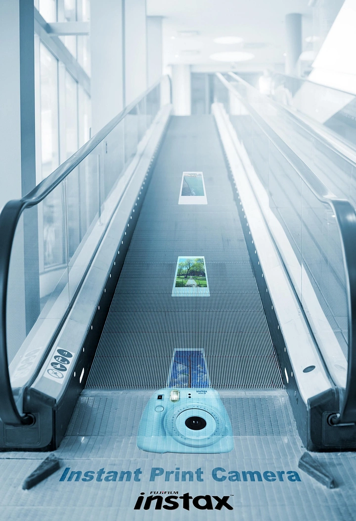 Cameras & Camera Stores creative ad: Clever ambient ad using a travelator