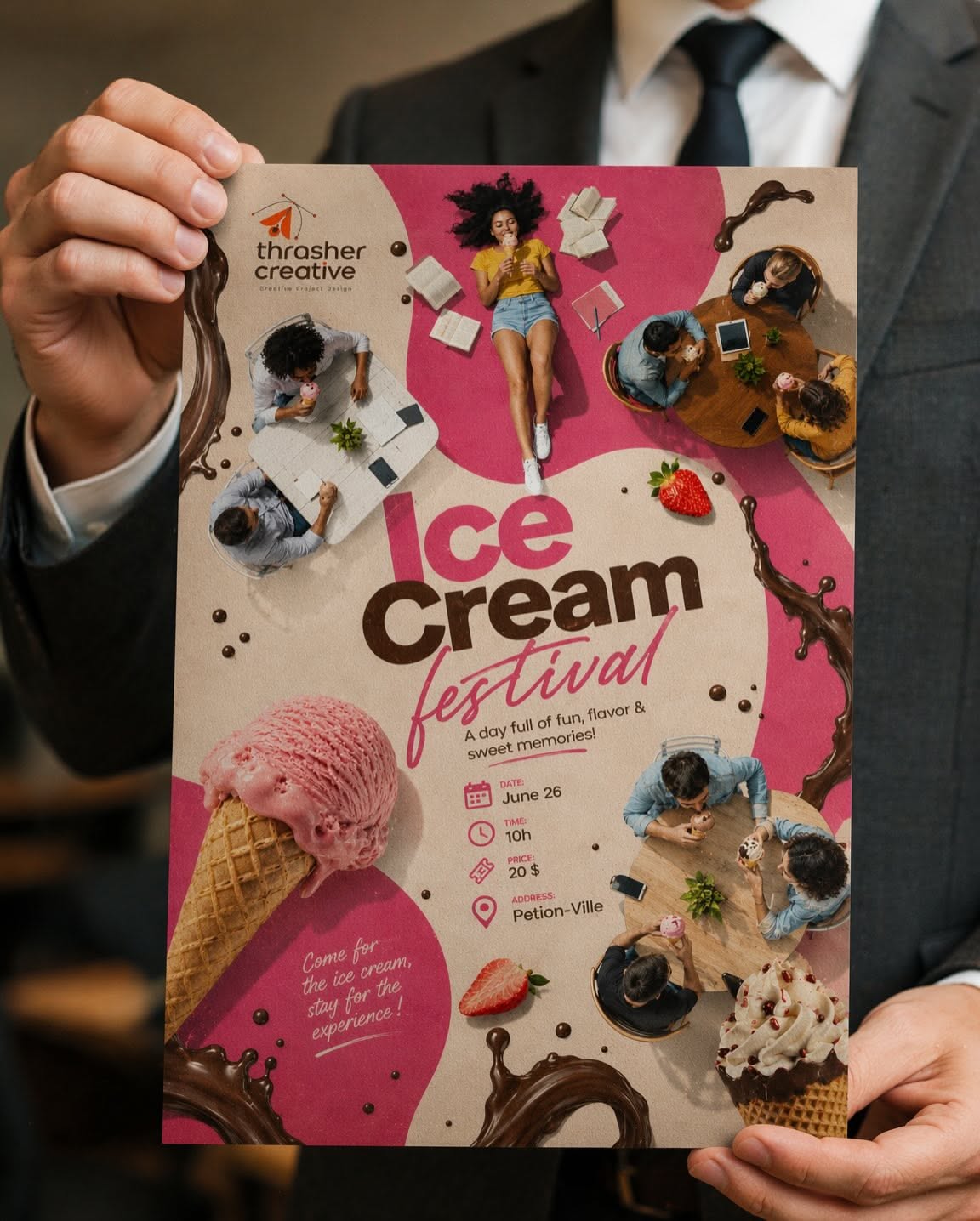 Carousel: Overhead view of people eating ice cream at cafe tables around a giant strawberry cone, slide 3