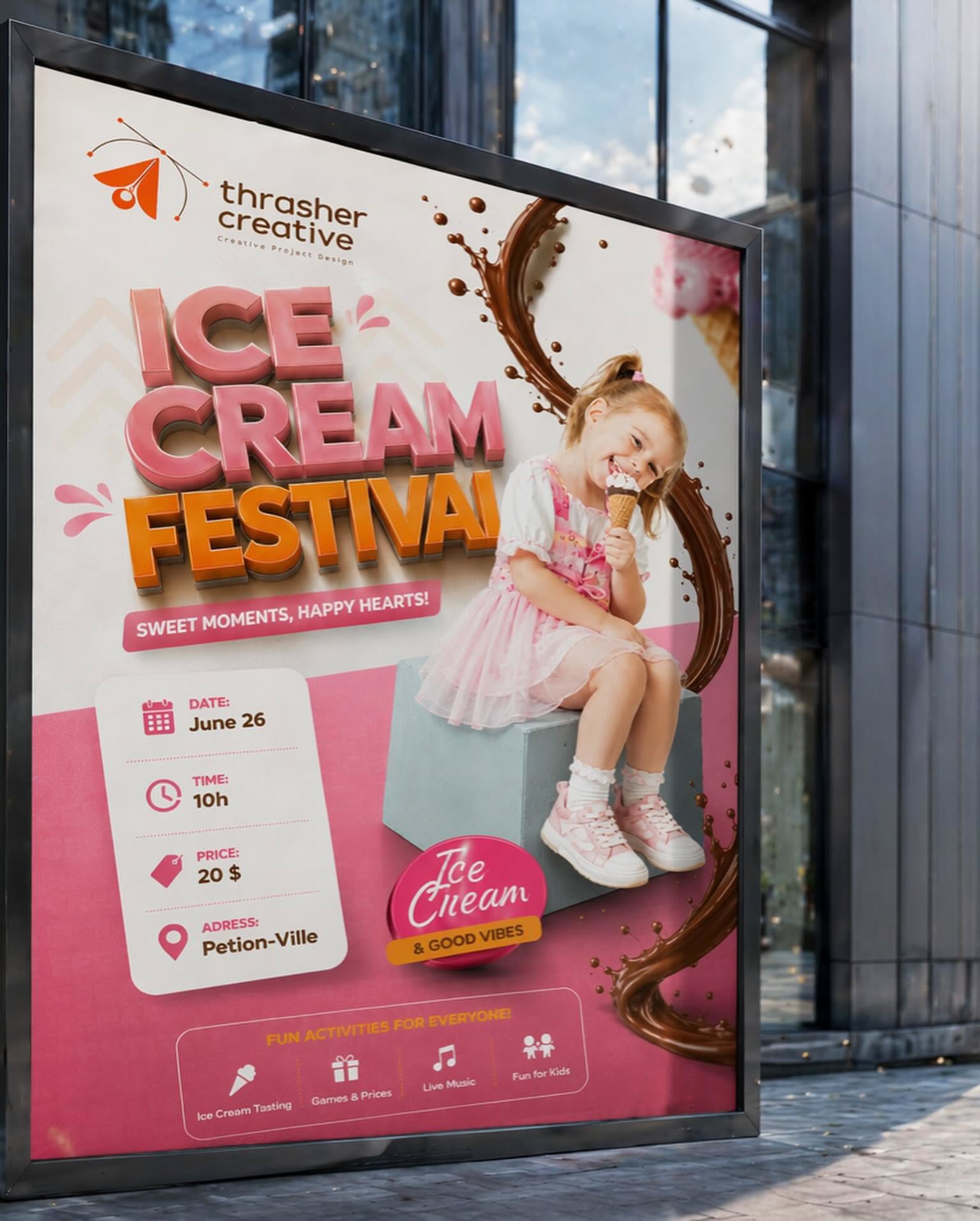 Carousel: Overhead view of people eating ice cream at cafe tables around a giant strawberry cone, slide 4
