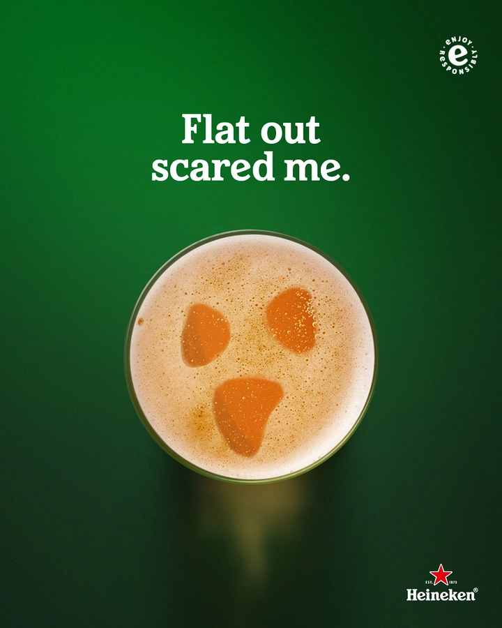 Halloween creative ad: Top-down beer glass whose foam forms a scared ghost face