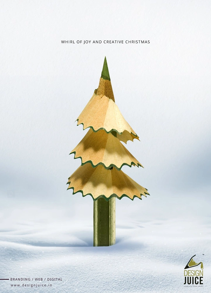 Christmas creative ad: Pencil stuck in snow with shavings forming a Christmas tree