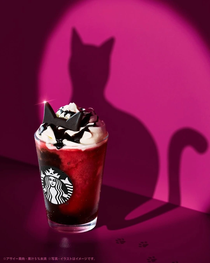 Halloween creative ad: Berry frappuccino with chocolate cat ears and cat shadow