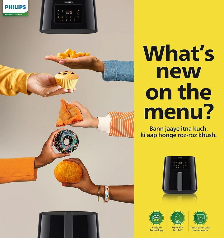 Home Appliances creative ad: Hands pass snacks between airfryers, playful