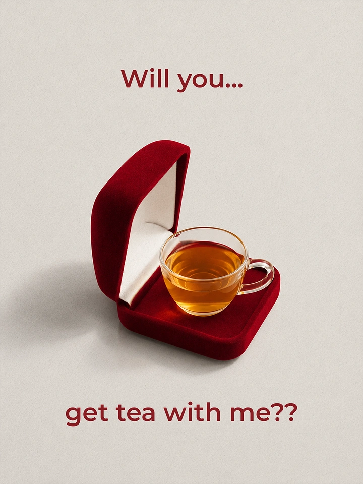 Valentine's Day creative ad: Glass cup of amber tea sitting in an open red velvet ring box