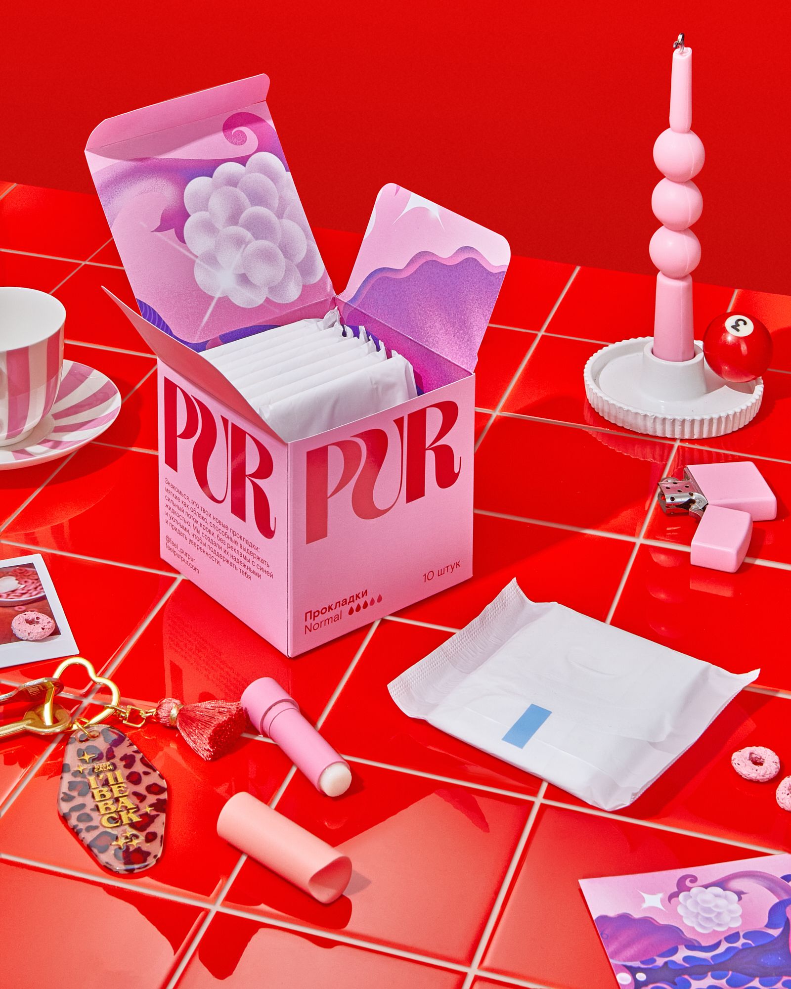 Instagram post: Open pink pad box on glossy red tiled table