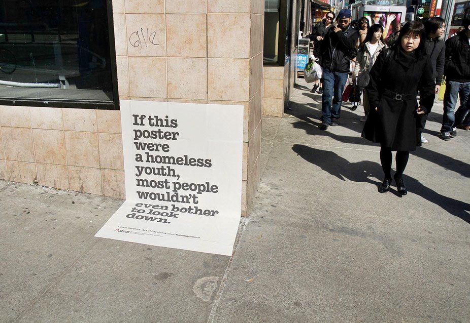 Creative: A large awareness poster positioned on a city sidewalk