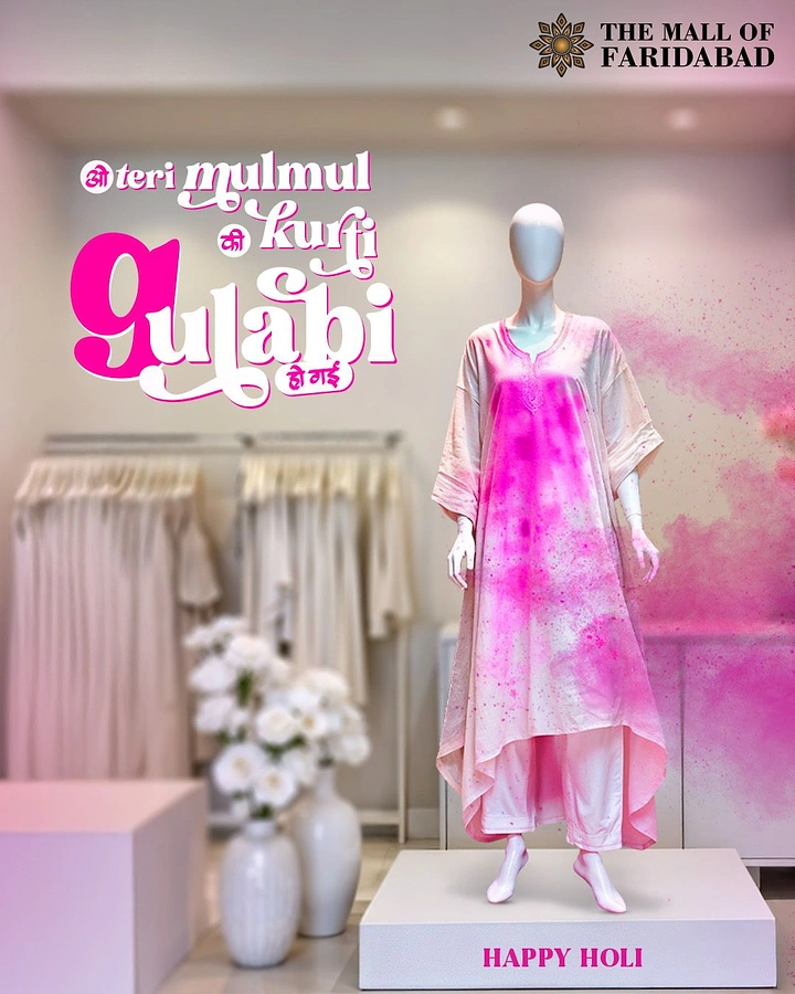Holi creative ad: Mannequin in white mulmul kurta splashed with pink gulal