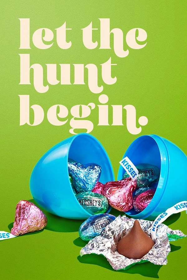 Easter creative ad: Open blue plastic egg spilling foil chocolates