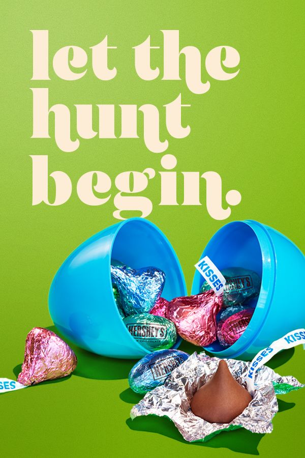Open blue plastic egg spilling foil chocolates