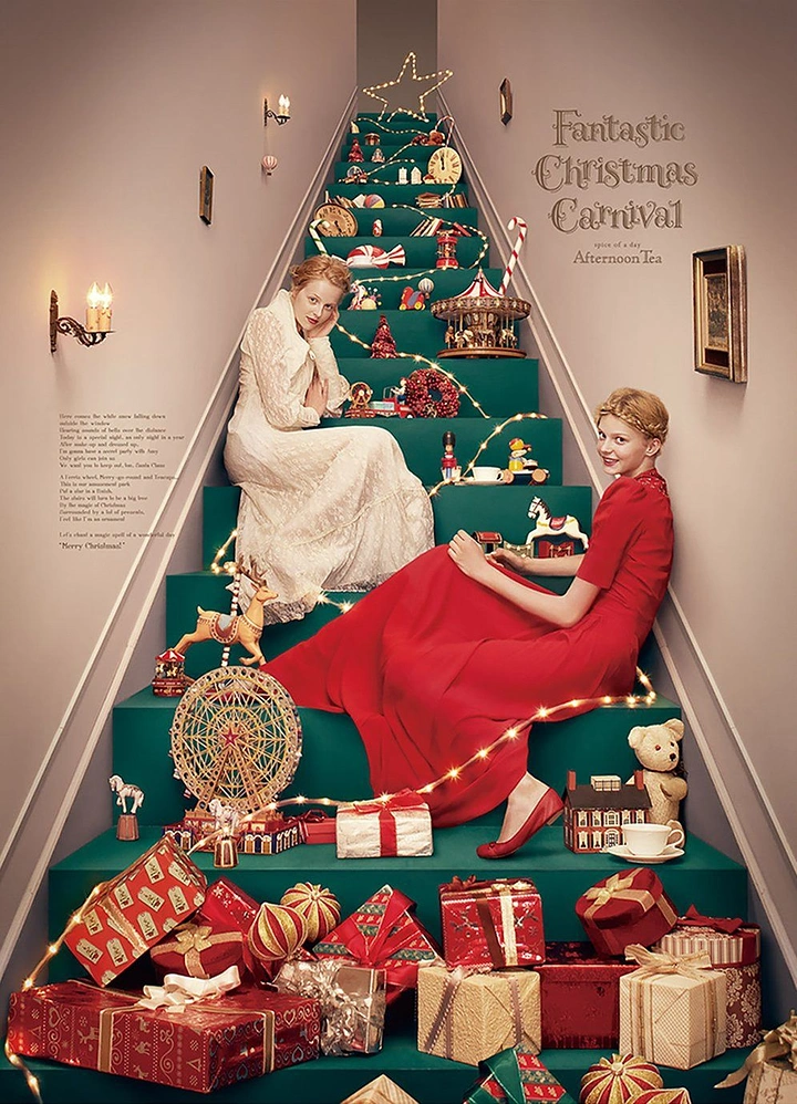 Christmas creative ad: Two women on a teal staircase styled as a Christmas tree of toys