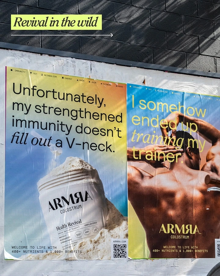 Supplements & Protein creative ad: Wheatpasted gradient posters on a street wall