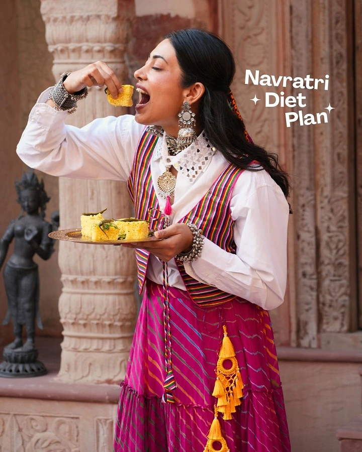Navratri creative ad: Woman in festive Gujarati outfit eating dhokla