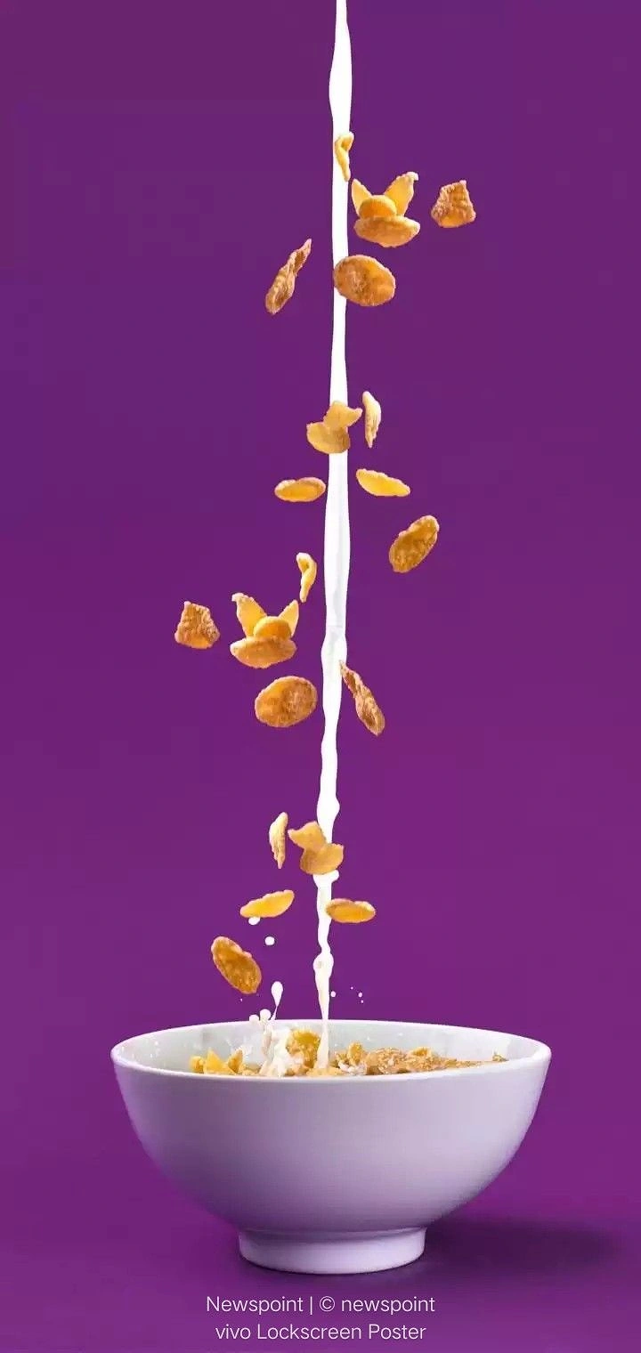 Breakfast Cereals & Oats creative ad: Vertical milk stream makes cereal dynamic