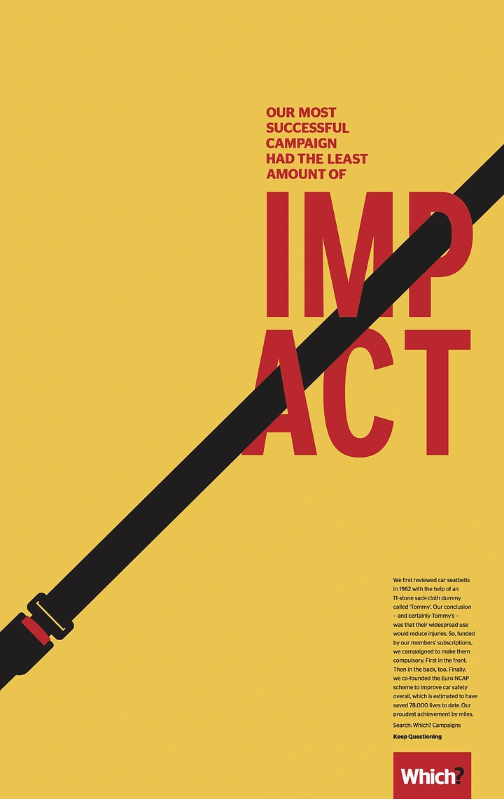 Creative ad: A flat black seatbelt strap slicing diagonally across a split word