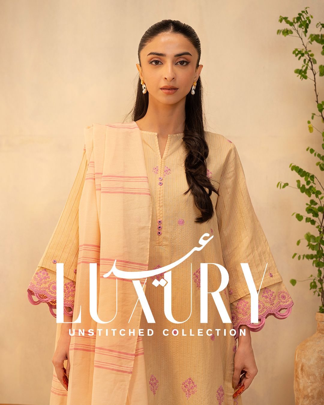 Eid Instagram post: Model in pale yellow embroidered lawn suit with pink striped dupatta