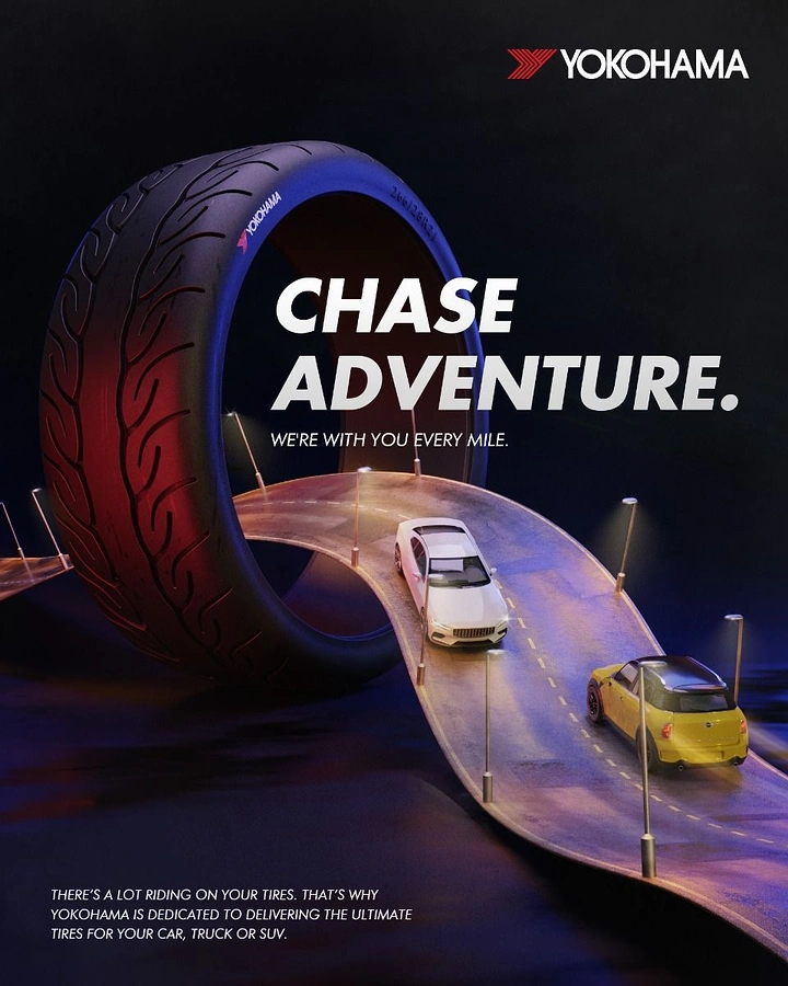 Automotive creative ad: Miniature road ribbon looping through an oversized tire with toy-like cars
