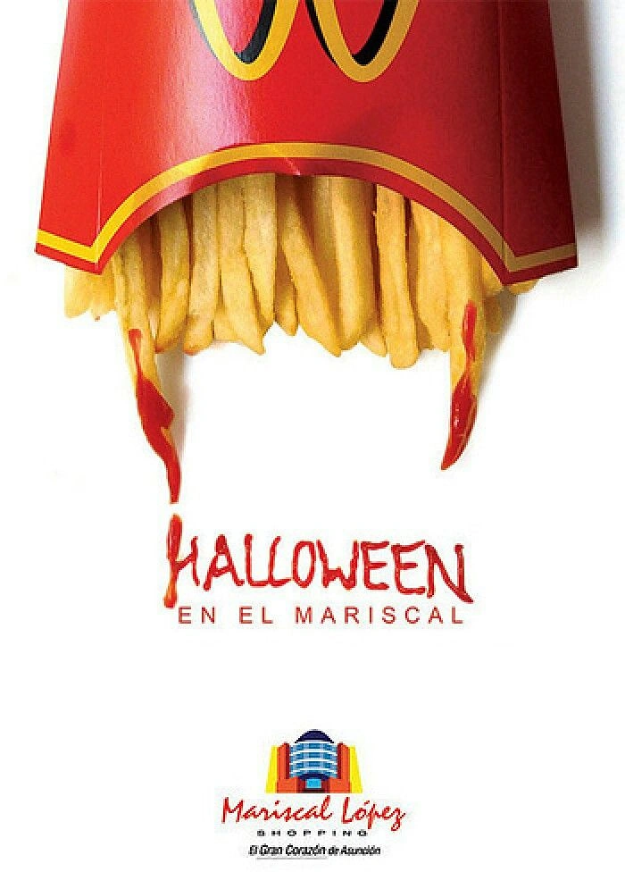 Halloween creative ad: Fries carton with ketchup-dripping fries forming vampire fangs