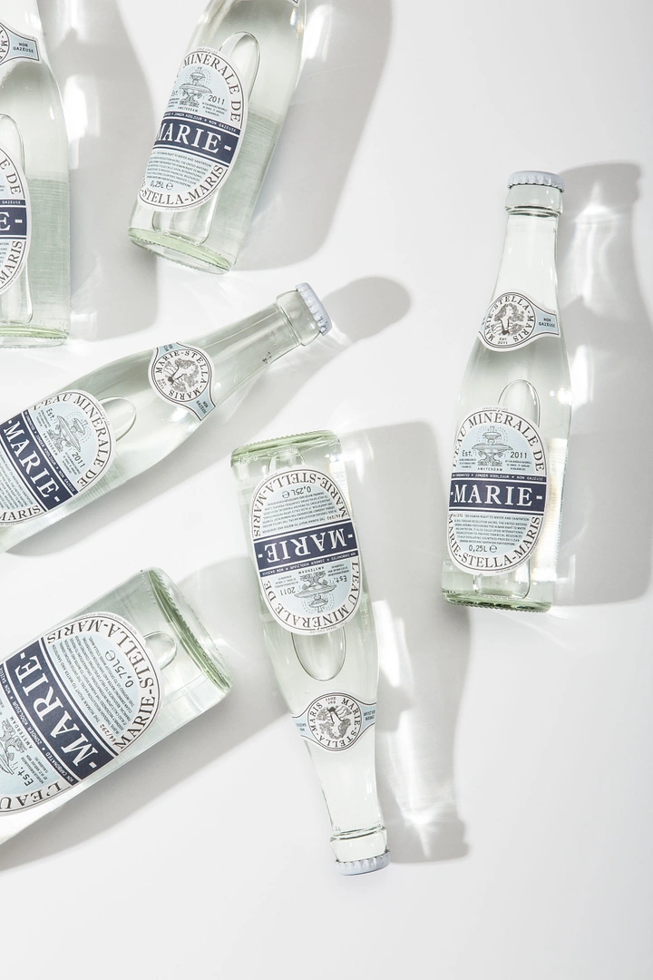 Packaged Drinking Water creative ad: Scattered bottles create distinctive overhead composition