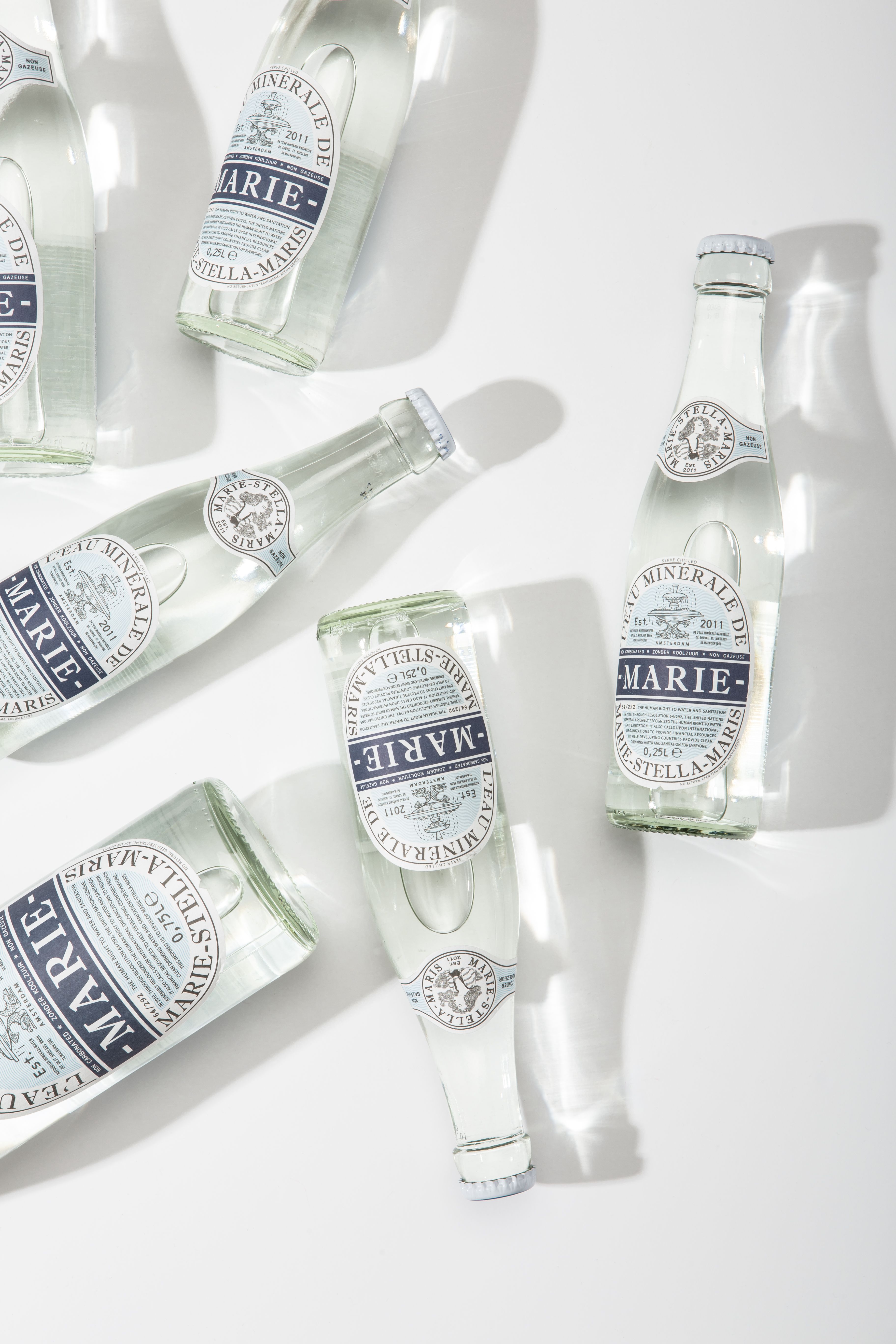 Story: Scattered bottles create distinctive overhead composition