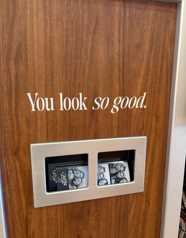 Photo Booth Rentals creative ad: Witty booth copy with integrated output slot