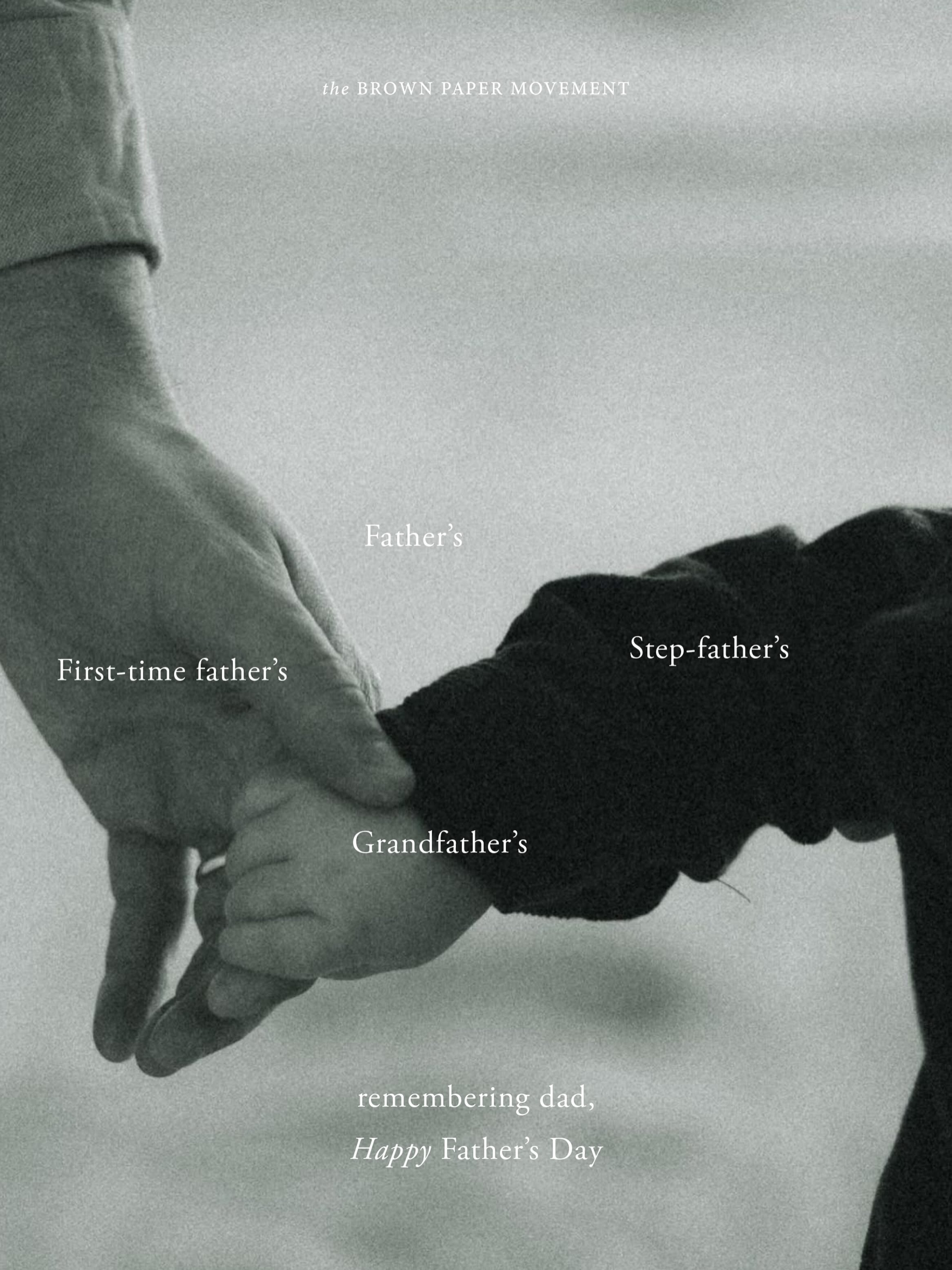 Adult hand holding a toddler's hand in black and white