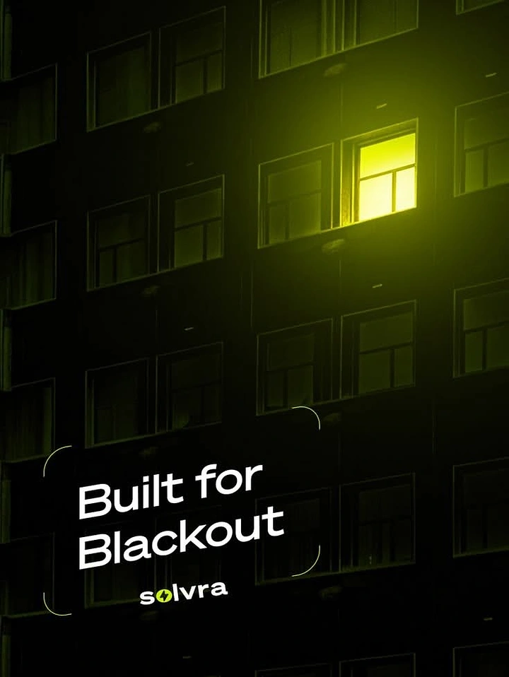 Solar & Energy creative ad: Dark apartment building facade with a single glowing window
