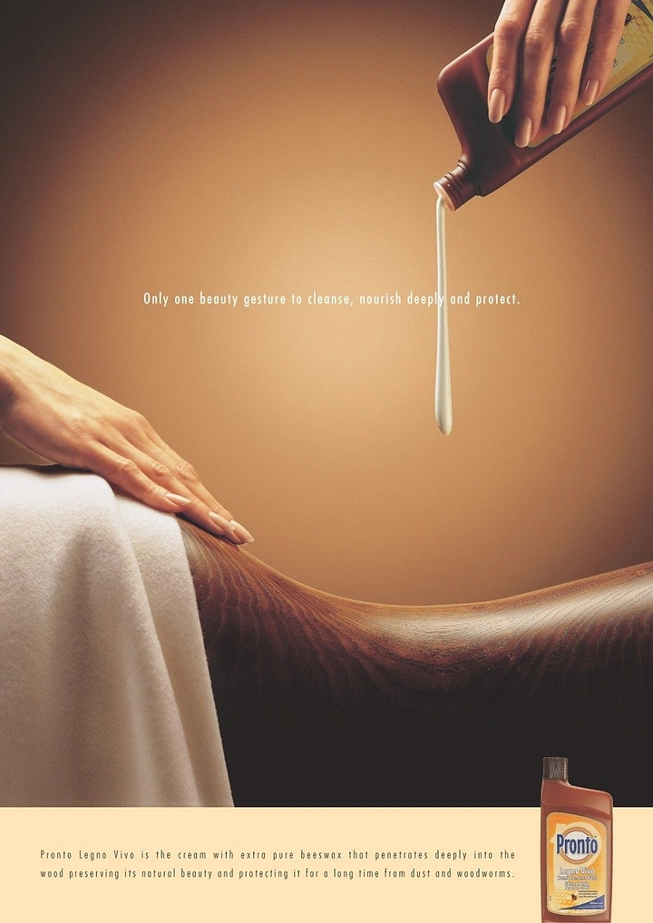 Creative ad: Wood surface shaped like a back receiving a spa-style cream pour