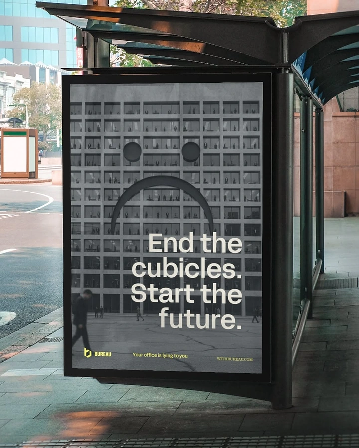 Co-working Spaces creative ad: Office facade grid with a sad face formed by windows