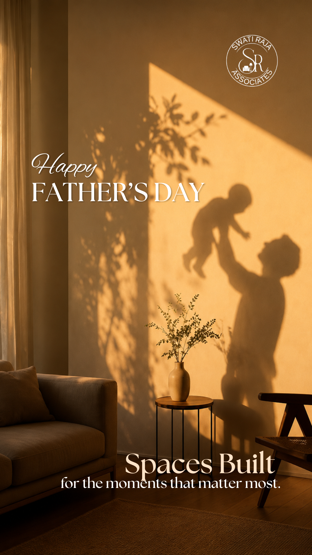Wall shadow of a father lifting a baby in a golden-lit room