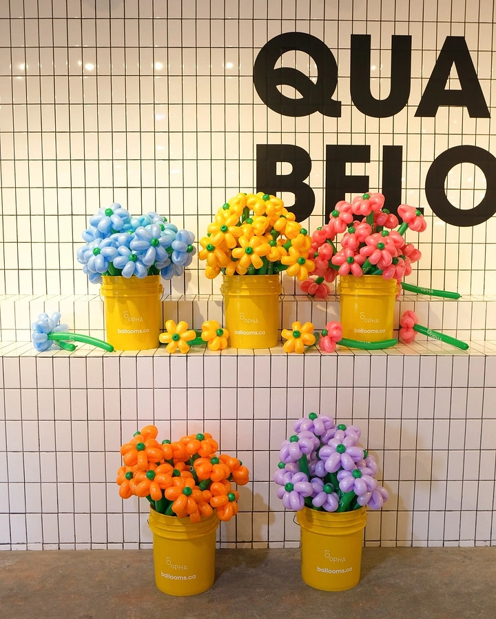 Balloon & Party Decorators creative ad: Balloon flowers create playful retail typography