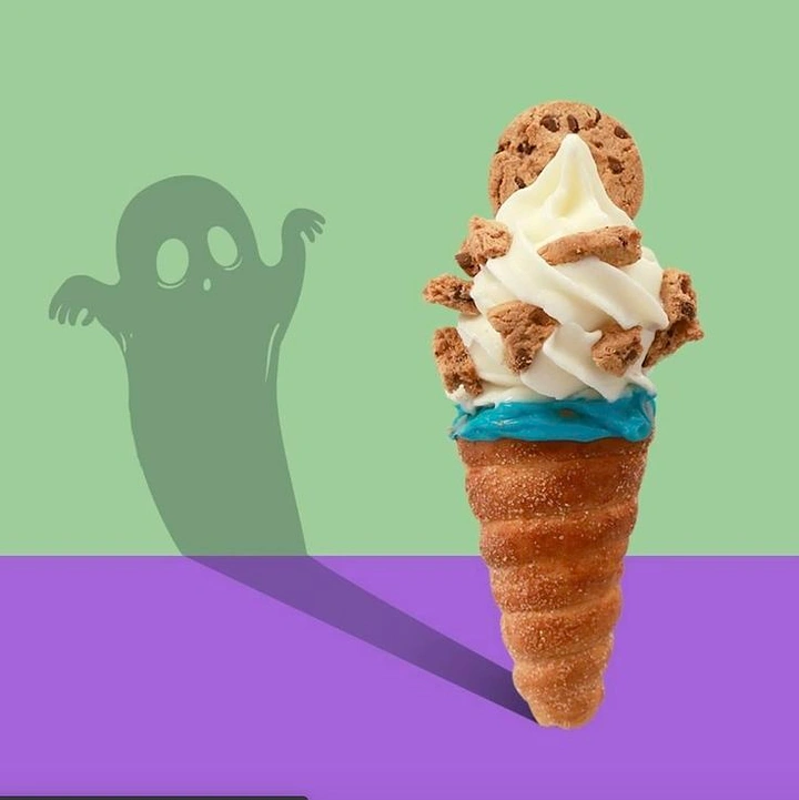 Halloween creative ad: Churro cone soft-serve casting a ghost-shaped shadow