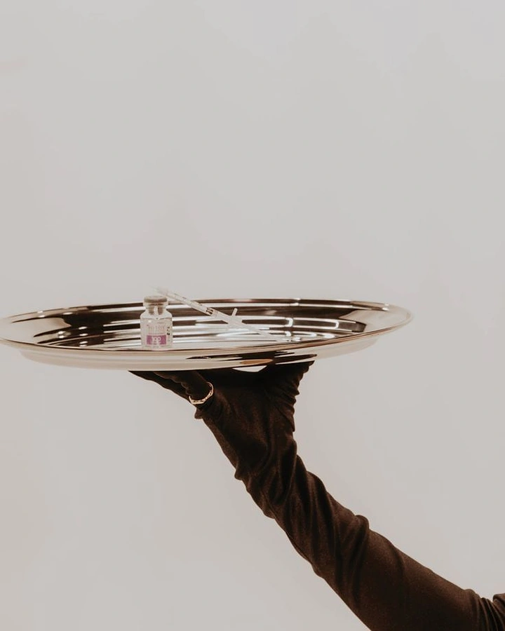 IV Therapy & Drip Bars creative ad: Surreal tray presentation creates memorable product metaphor