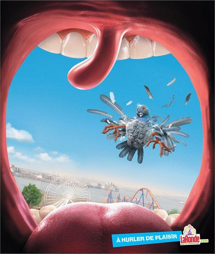 Amusement & Water Parks creative ad: View from inside a screaming mouth: a pigeon blasted apart into feathers over an amusement park